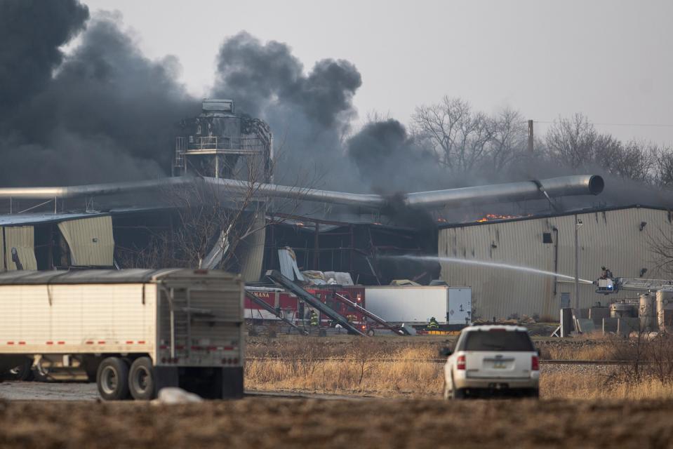 Firefighters work to control a blaze at C6-Zero on Thursday, Dec. 8, 2022, in Marengo, Iowa. The plant breaks down asphalt shingles into fiberglass, gravel and oil.