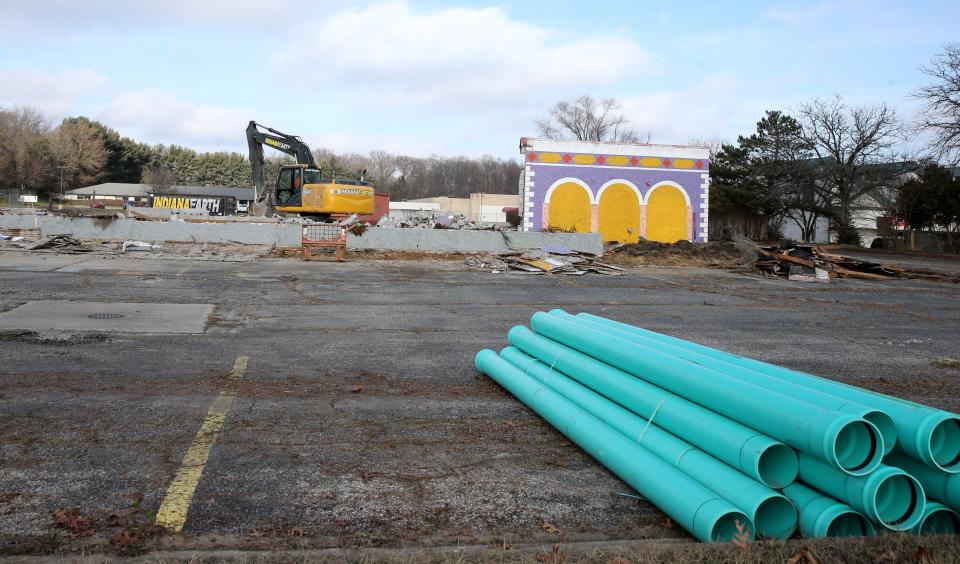 Crews raze the former restaurant at Cleveland Road near Grape Road Tuesday, Jan. 2, 2024, in Mishawaka to make room for a three-story self-lock storage facility planned for the property.