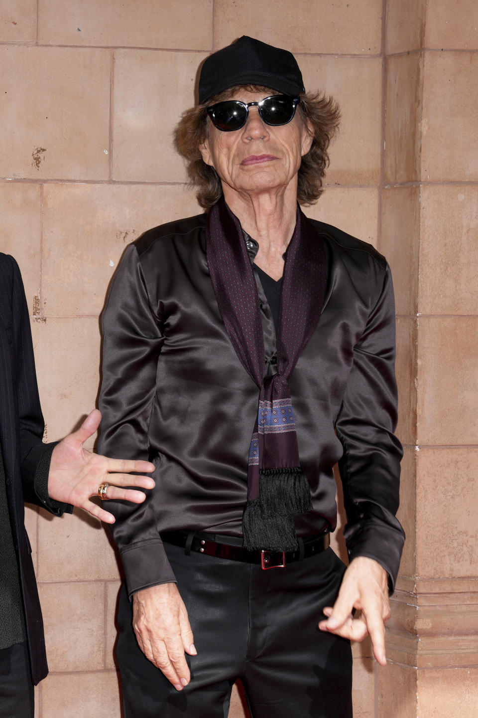 Mick Jagger poses for photographers upon arrival at the Rolling Stones Hackney Diamonds launch event on Wednesday, Sept. 6, 2023 in London. (Scott Garfitt/Invision/AP)