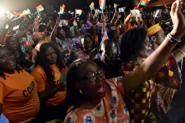 Supporters of Burkina Faso's new president Roch Marc Christian Kabore celebrate at party headquarters in Ouagadougou on December 1, 2015 after he won Burkina Faso's presidential election