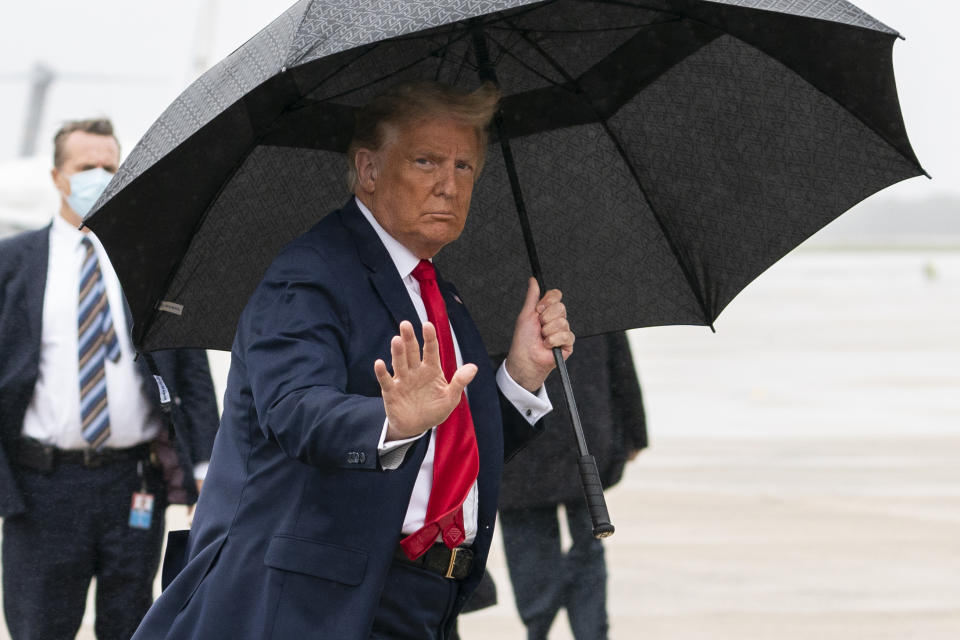 President Donald Trump boards Air Force One for a campaign rally in Sanford, Fla., Monday, Oct. 12, 2020, in Andrews Air Force Base, Md. (AP Photo/Evan Vucci)