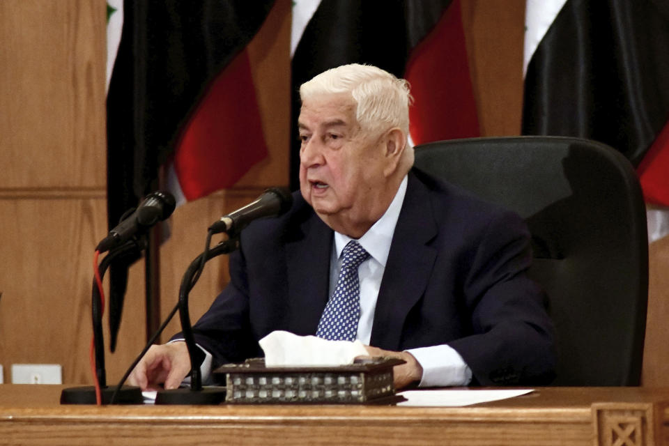 In this photo released by the Syrian official news agency SANA, Syrian Foreign Minister Walid al-Moallem speaks during a press conference, in Damascus, Syria, Tuesday, June 23, 2020. Walid al-Moallem accused the United States on Tuesday of allegedly "seeking to starve the people" of Syria by imposing new sanctions and opening the door for "terrorism" to return to the war-torn country. (SANA via AP)