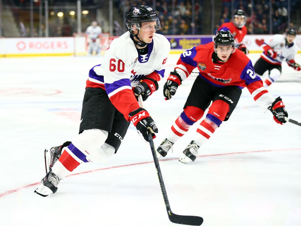 Openly gay NHL player Luke Prokop, left, now plays minor league hockey for the Edmonton Oil Kings after a recent trade.