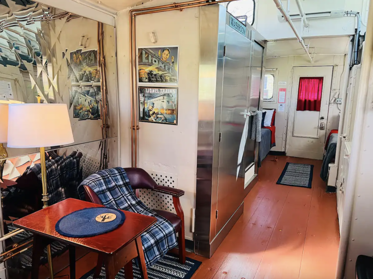 1941 Restored Vintage Caboose Interior: table, chairs, two twin beds