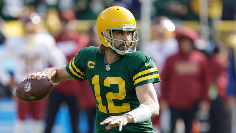 Aaron Rodgers and the Packers are underdogs against the undefeated Cardinals. (AP Photo/Matt Ludtke)