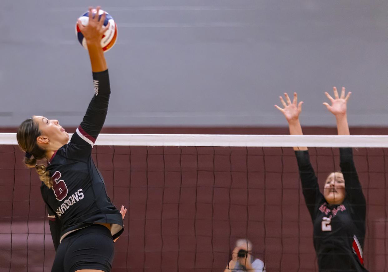 Austin High outside hitter Riley Malloy whips the ball for a kill against Lake Travis setter Kacey Kazmierski during their District 26-6A match on Sept. 26, 2023.