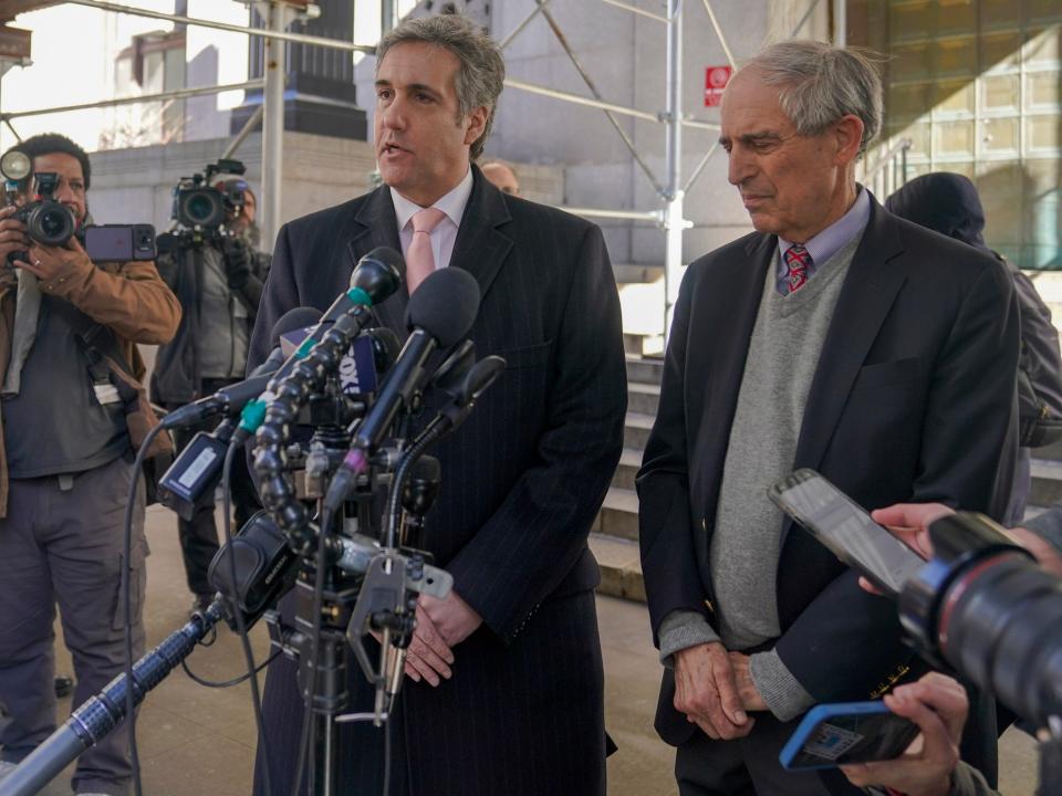 Donald Trump's former lawyer and fixer Michael Cohen, center, is joined by his attorney, Lanny Davis before Cohen's grand jury appearance in mid-March.