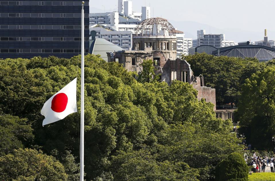 <p>A Japanese national flag flies at half-mast during the memorial ceremony for victims of the Aug. 6,1945 atomic bombing at the Hiroshima Peace Memorial Park in Hiroshima, Japan, Aug. 6, 2017. (Photo: Kimimasa Mayama/EPA/REX/Shutterstock) </p>