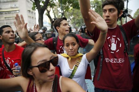 Opposition students march against Venezuelan President Nicolas Maduro's government in Caracas February 12, 2015. REUTERS/Jorge Silva