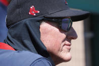 Boston Red Sox interim manager Ron Roenicke watches from the dugout during a spring training baseball game against the Houston Astros, Thursday, March 5, 2020, in Fort Myers, Fla. (AP Photo/Elise Amendola)