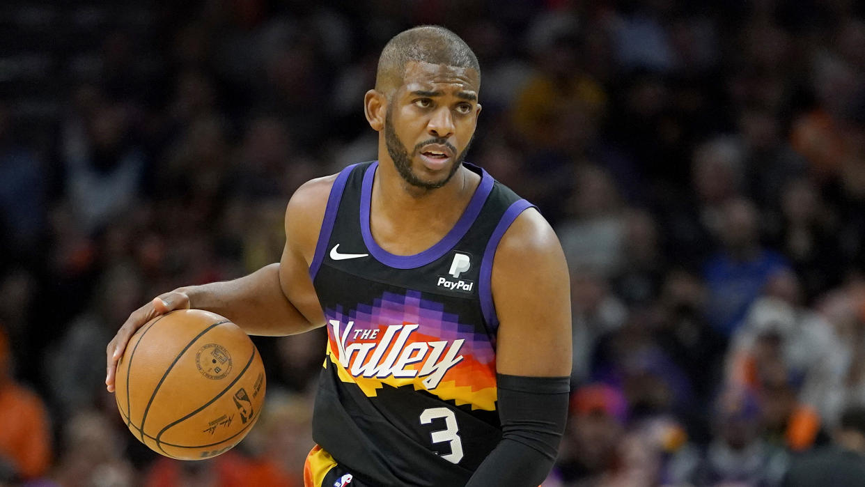 Phoenix Suns guard Chris Paul (3) looks to pass against the New Orleans Pelicans during the first half of Game 5 of an NBA basketball first-round playoff series, Tuesday, April 26, 2022, in Phoenix. (AP Photo/Matt York)