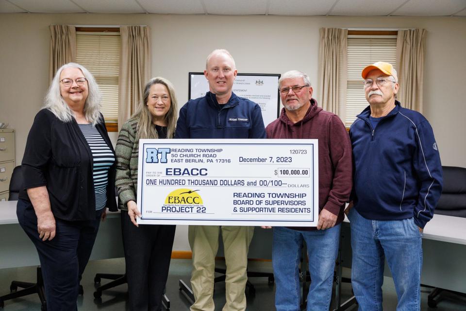 From left, East Berlin Area Community Center(EBACC) Operations Manager Pamalee Lady, EBACC Vice President Robin Heyser, Reading Township Supervisor Jason Phillips, Reading Township Board President Kevin Holtzinger, and Reading Township supervisor Wes Thomason, pose for a photo with a check that the township supervisors presented to EBACC towards their upcoming facility, Thursday, Dec. 7, 2023, at the Reading Township municipal building. EBACC purchased a 22 acre lot on Route 194, which will be the future home for EBACC.