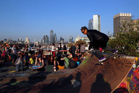 A skateboarder is seen during the Extinction Rebellion protest on Waterloo Bridge in London, Britain April 20, 2019. REUTERS/Simon Dawson