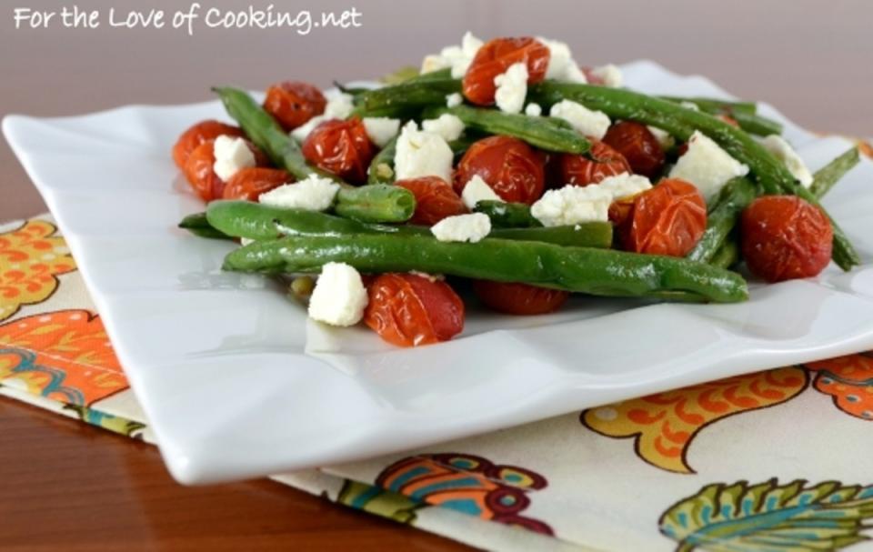 <p>For the Love of Cooking</p><p>Feta makes any summer produce, however simply cooked, so much better. </p><p><strong>Get the recipe: <a href="http://www.fortheloveofcooking.net/2014/05/roasted-green-beans-and-tomatoes-topped-with-feta.html" rel="nofollow noopener" target="_blank" data-ylk="slk:Roasted Green Beans and Tomatoes Topped with Feta;elm:context_link;itc:0;sec:content-canvas" class="link ">Roasted Green Beans and Tomatoes Topped with Feta</a></strong></p>