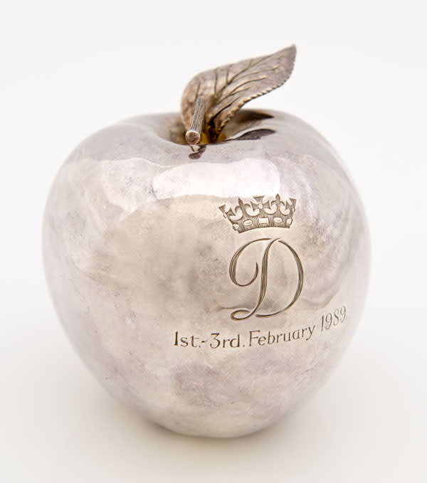 A rare silver apple given by Princess Diana to her dresser, Fay Appleby, to commemorate their visit to New York. It's beleived to be one of only four made and is engraved with the Princess's crowned D monogram. The apple was won by a collector in Colchester against international interest (Reeman Dansie)