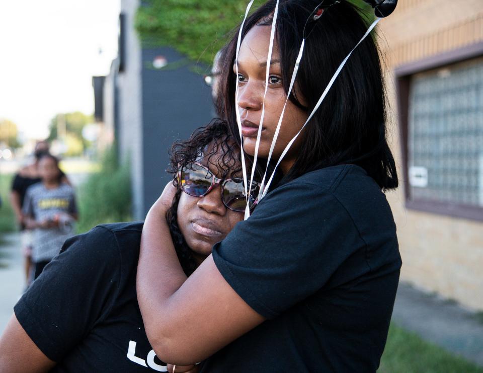 Myha Lee, mother of Chayne Lee, is comforted by Chaylee's stepsister Jackie Scruggs during a vigil for Chayne Lee outside of Beulah Grove Missionary Baptist Church in Detroit on Sept. 3, 2022. Chayne Lee was killed last Sunday in Detroit in a random shooting spree that left three people dead. Family members of Chayne Lewis Lee hosted a vigil Saturday evening in honor of his life. The 28-year-old was shot and killed on Aug.28 at around 4:45 a.m. near Seven Mile Road and Wyoming Avenue after suspected gunman Dontae Ramon Smith randomly shot him, police say.