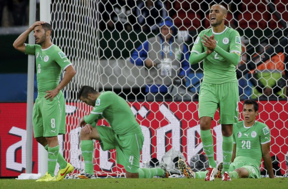 Algeria's players react after conceding a second goal against Germany in extra time during their 2014 World Cup round of 16 game at the Beira Rio stadium in Porto Alegre June 30, 2014. REUTERS/Edgard Garrido
