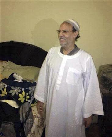 Essam el-Erian, deputy leader of the Muslim Brotherhood's Freedom and Justice party, smiles as he stands next to a bed after being detained by security forces in New Cairo in this handout photo provided by the Egyptian Interior Ministry October 30, 2013. Egyptian authorities have detained the senior Muslim Brotherhood leader, an Interior Ministry source said on Wednesday, the latest arrest in a government crackdown against the Islamist movement. Erian was taken into custody from a residence in New Cairo where he had been in hiding. REUTERS/Egyptian Interior Ministry/Handout