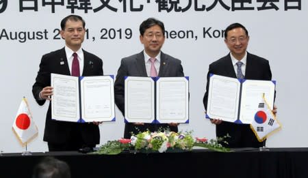 The culture ministers of Japan, South Korea and China pose during their trilateral meeting in Incheon