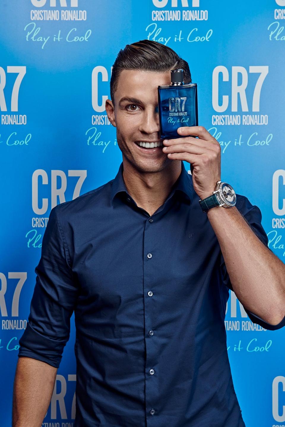 Cristiano Ronaldo with a CR7 fragrance (CR7 Play It Cool via Getty Image)