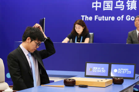 Chinese Go player Ke Jie reacts during his first match with Google's artificial intelligence program AlphaGo at the Future of Go Summit in Wuzhen, Zhejiang province, China May 23, 2017. REUTERS/Stringer