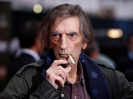 FILE PHOTO: Actor Harry Dean Stanton smokes a cigarette as he poses at the world premiere of the film "Marvel's The Avengers" in Hollywood, California, U.S. on April 11, 2012. REUTERS/Danny Moloshok/File Photo