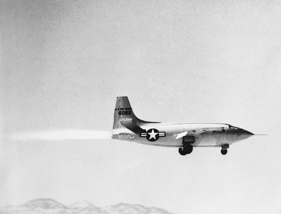 The Bell X-1 on on first powered take off of the Supersonic plane. Picture taken shortly after take off. All four cylinders of rocket engine are in operation.