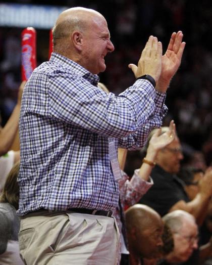 Los Angeles Clippers new owner Steve Ballmer applauds after his team defeated the Oklahoma City Thunder 93-90 during an NBA basketball game in Los Angeles, Thursday, Oct. 30, 2014. (AP Photo/Alex Gallardo)