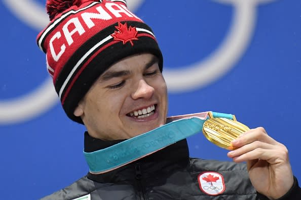 Canada's gold medallist Mikael Kingsbury poses on the podium during the medal ceremony for the freestyle skiing men's moguls at the PyeongChang Medals Plaza during the PyeongChang 2018 Winter Olympic Games in PyeongChang on February 13, 2018. | AFP—Getty Images