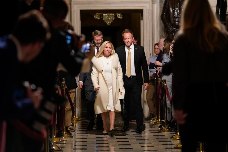 Rep Marjorie Taylor Greene arrives in the chamber (AP)