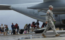 Evacuees board a U.S. military C-130 aircraft as they leave the town after super typhoon Haiyan battered Tacloban City in central Philippines November 12, 2013. REUTERS/Edgar Su (PHILPPINES - Tags: DISASTER ENVIRONMENT MILITARY SOCIETY)