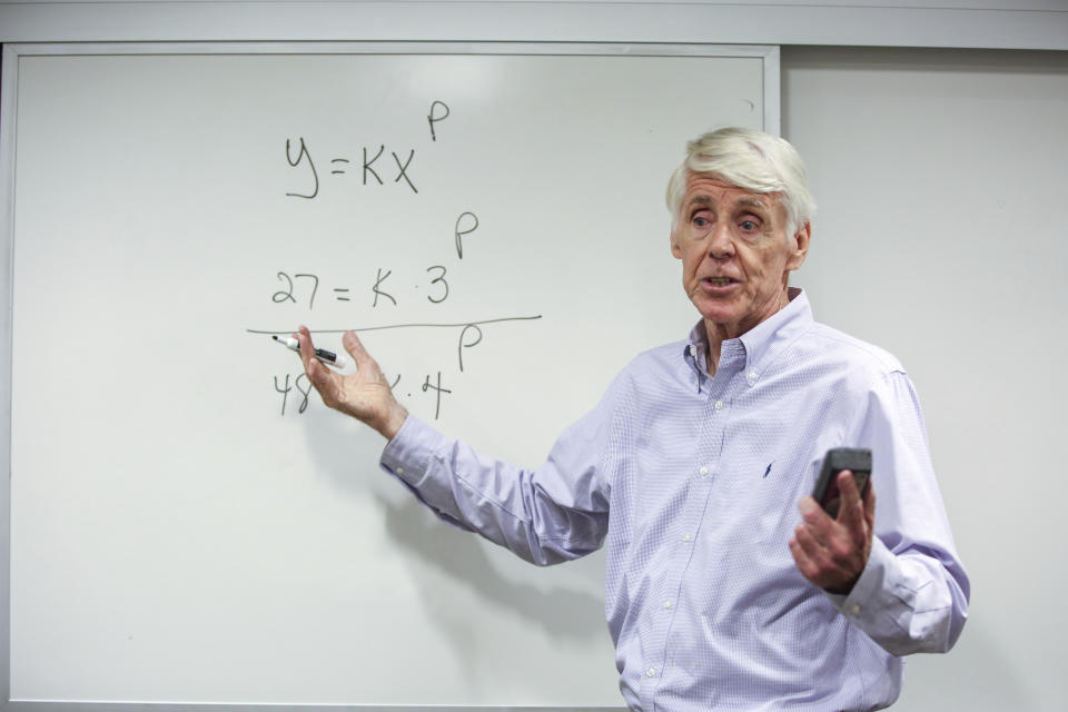 Teacher Jerry Howland explains an equation during the Bridge to Calculus summer program at Northeastern University in Boston on Tuesday, Aug. 1, 2023. (AP Photo/Reba Saldanha)