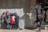 <p>Women react as an Israeli mounted policeman disperses Palestinian protesters on Dec. 9, 2017, in East Jerusalem. (Photo: Ahmad Gharabli/AFP/Getty Images) </p>