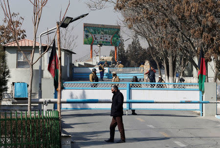 Afghan security forces stand guard at the enternce gate of the Intercontinental Hotel a day after an attack in Kabul, Afghanistan January 22, 2018. REUTERS/Omar Sobhani