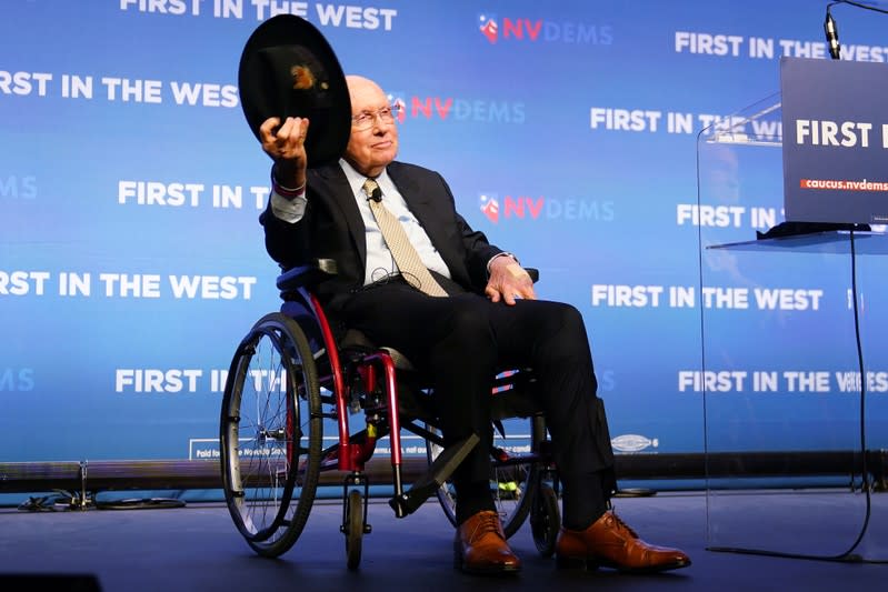 Former United States Senator Harry Reid tips his hat on stage at a First in the West Event at the Bellagio Hotel in Las Vegas