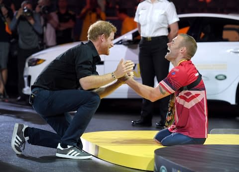 Prince Harry congratulates Mark Ormrod in Toronto - Credit: Karwai Tang