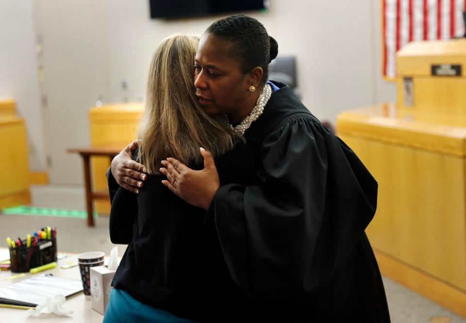 State District Judge Tammy Kemp gives former Dallas Police Officer Amber Guyger a hug before Guyger leaves for jail, Wednesday, Oct. 2, 2019, in Dallas.