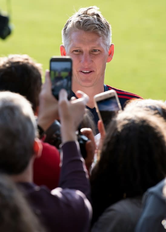 Bastian Schweinsteiger smiles as he meets fans on Sunday during a training session with Chicago Fire in Munich ahead of his testimonial on Tuesday against Bayern Munich at the Allianz Arena, when he will play a half each for both clubs