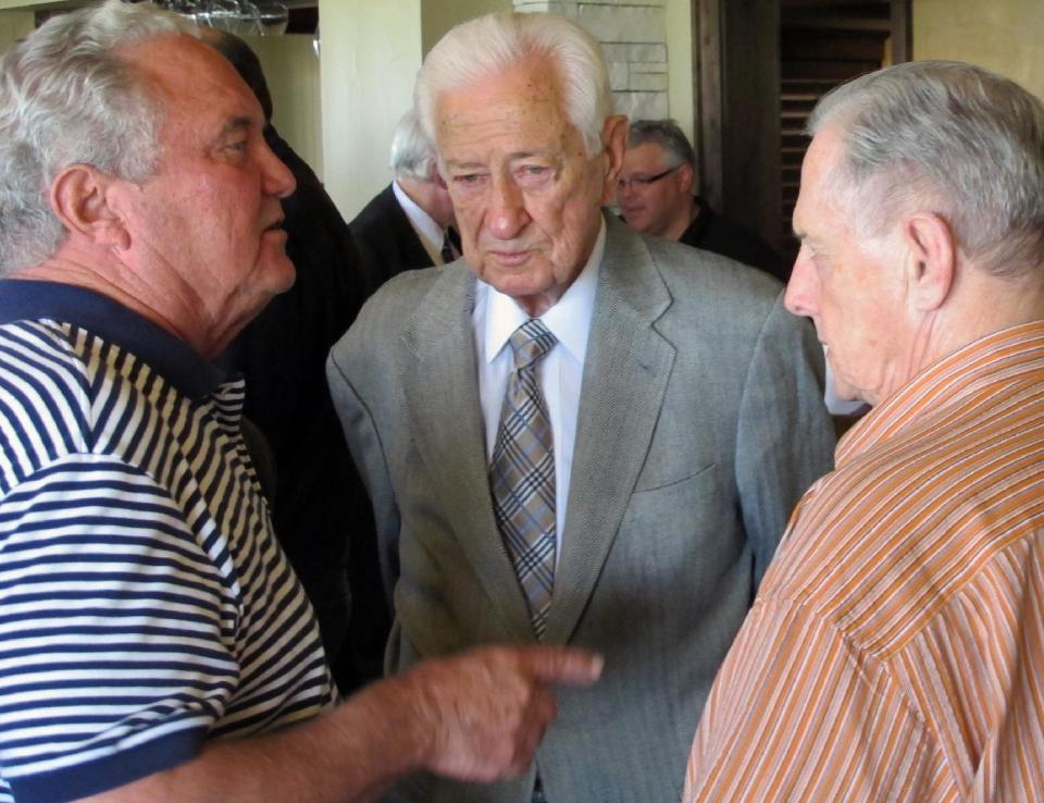 In this April 11, 2014 photo, U.S. Rep. Ralph Hall mingles with fellow military veterans at a weekly "Band of Brothers" happy hour he attends nearly every week in his hometown of Rockwall, Texas. A 90-year-old World War II veteran, Hall is the oldest-ever member of the U.S. House and insists heís campaigning the same way he always does, but faces a potentially tough May 27 Republican primary election in his district east of Dallas. (AP Photo/Will Weissert)