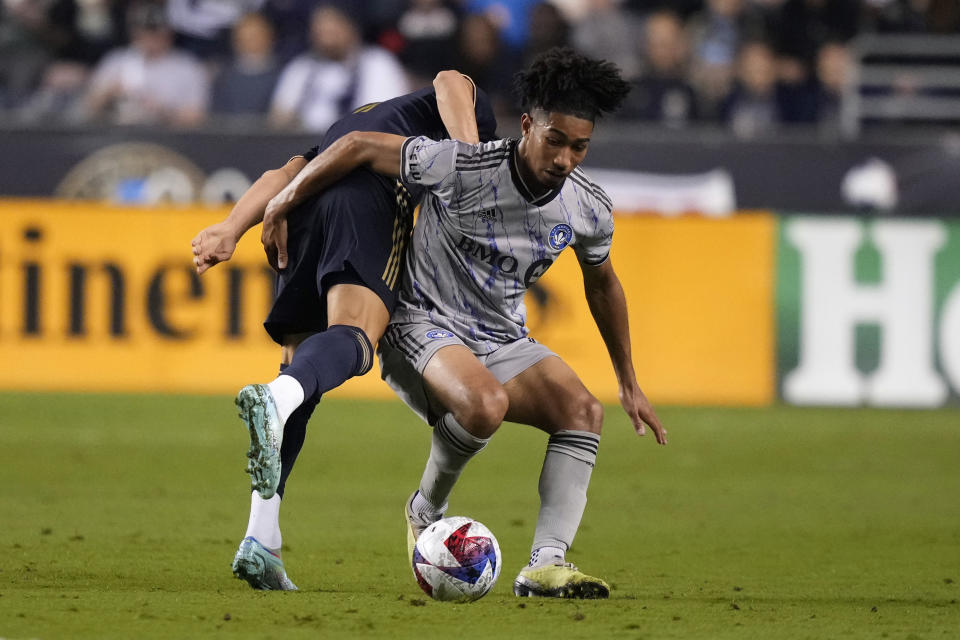 Philadelphia Union's Julián Carranza, left, and CF Montréal's Nathan-Dylan Saliba battle for the ball during the second half of an MLS soccer match, Saturday, June 3, 2023, in Chester, Pa. (AP Photo/Matt Slocum)