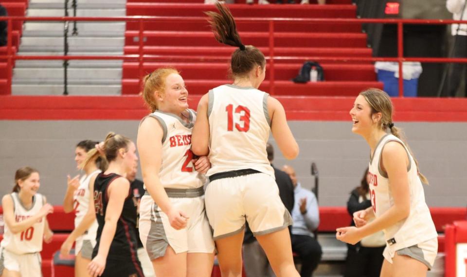 Aubrey Hensley, Payton Pudlowski and Victoria Gray (left to right) celebrate Bedford's 43-38 win over Dexter Tuesday night that clinched at least a share of the Southeastern Conference Red championship.