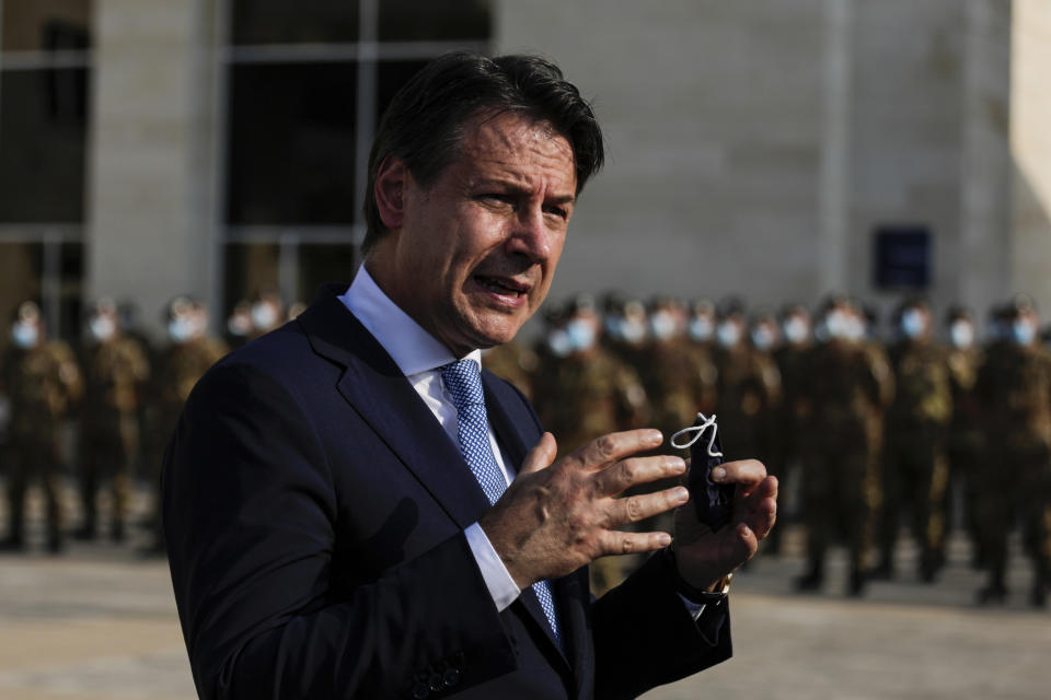 Italian Prime Minister Giuseppe Conte speaks to journalists as he visits an Italian field hospital set up at the Lebanese University in the Hadath district of Beirut, Lebanon, Tuesday, Sept. 8, 2020. Conte said Tuesday his country will support Lebanon's economic and social growth, expressing hopes that a new government is formed quickly — one that would start the reconstruction process in the wake of last month's Beirut explosion and implement badly needed reforms. (AP Photo/Hassan Ammar)