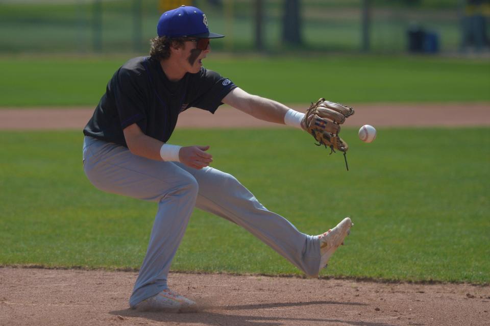 Fort Collins baseball player Dylan Rubenstein fields a ball during a game against Rocky Mountain at City Park in Fort Collins on May 6, 2023. Fort Collins won 12-1.