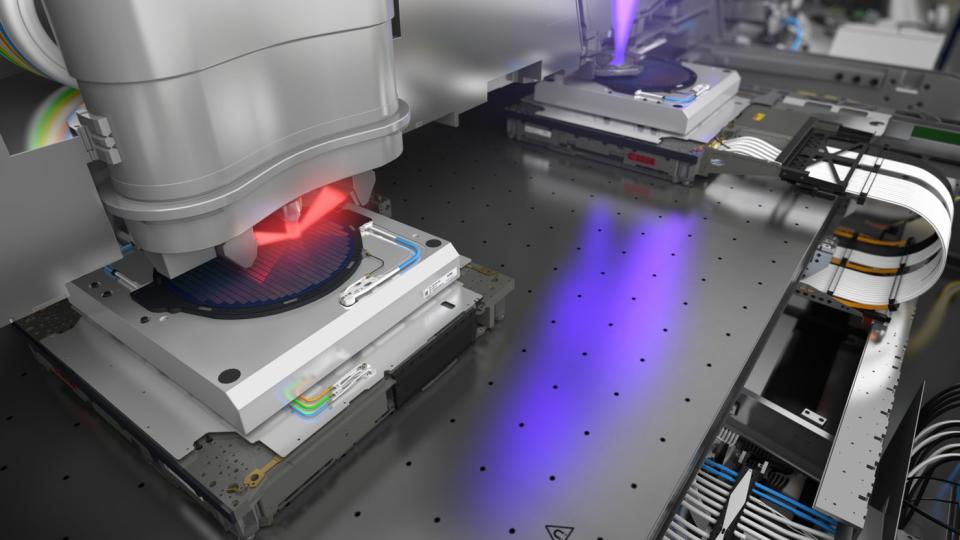 An image of a machine printing a silicon wafer.