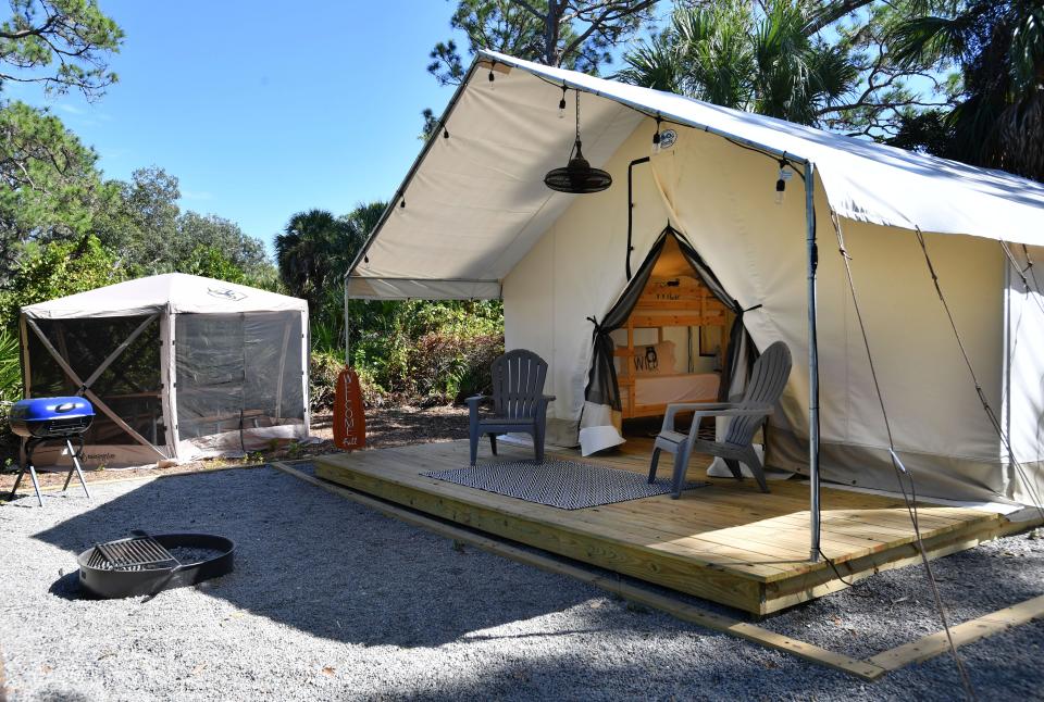 The Timberline Glamping site #106 at Oscar Scherer State Park in Osprey, is an air conditioned, 320 square-foot, canvas wall tent, set up with a king-size bed and two sets of bunk beds. All the Timberline Glamping sites have a firepit, picnic table, string lights, grill and two camp chairs.