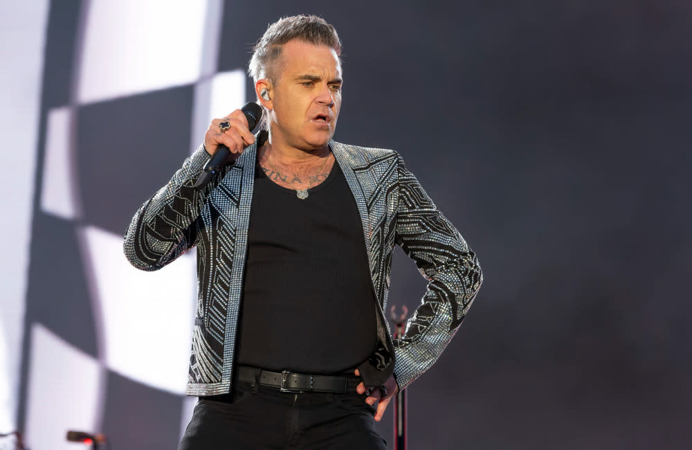 Robbie Williams looks set to catch up with his old Take That bandmates in Leeds credit:Bang Showbiz