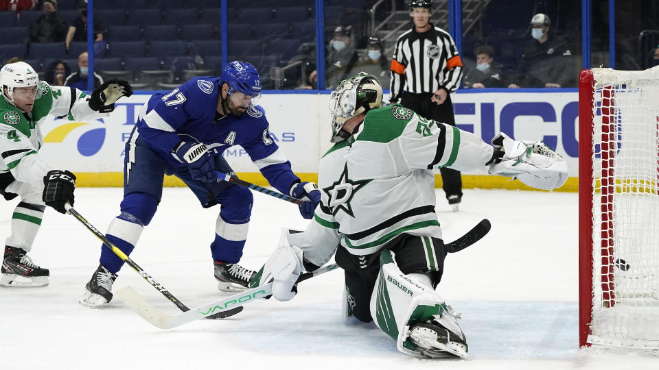 Tampa Bay Lightning left wing Alex Killorn (17) shoots past Dallas Stars goaltender Jake Oettinger (29) for a goal during the second period of an NHL hockey game Wednesday, May 5, 2021, in Tampa, Fla. (AP Photo/Chris O'Meara)