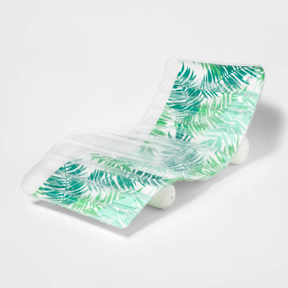 This image provided by Target shows a curvy palm-printed pool lounger with a drink holder. (Target via AP)