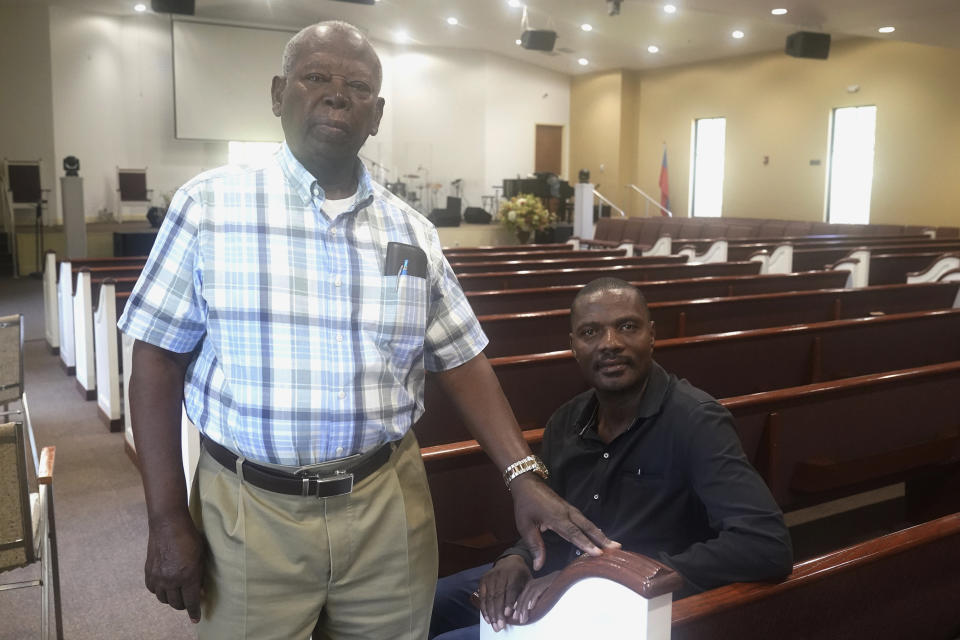 Senior Pastor Jean Bilbalo Joint, left, and Osambert Jean stand at the Haitian Baptist Church, Tuesday, Aug. 17, 2021, in Boynton Beach, Fla. The South Florida suburb holds deep ties to the town in southwestern Haiti that was hard hit by Saturday’s 7.2 magnitude earthquake. Many residents here have been worried about their loved ones. Some are already mourning cousins and uncles who died while officials are trying to assess the needs, rallying the coastal town in the relief effort. (AP Photo/Marta Lavandier)