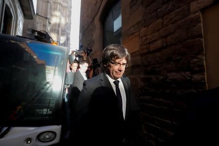 Catalan President Carles Puigdemont leaves the regional government headquarters after delivering a statement in Barcelona, Spain, October 26, 2017. REUTERS/Yves Herman